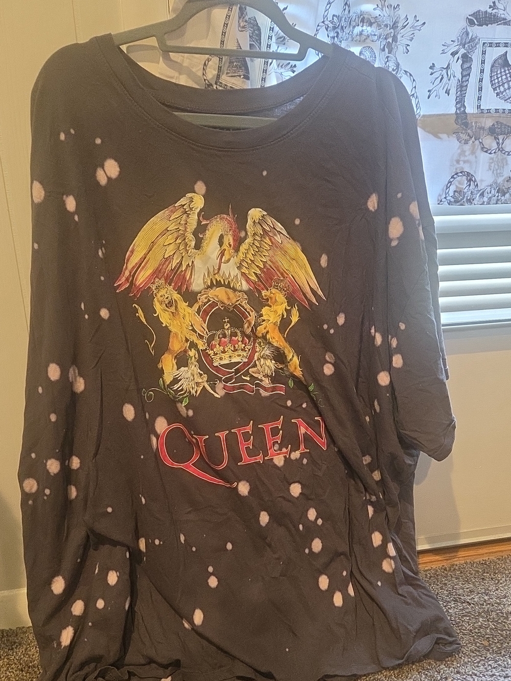 Que Black Long Sleeve Tee with Pink Bleach Spots and Gold Crest
